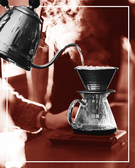 gooseneck kettle pouring into a pour-over coffee device